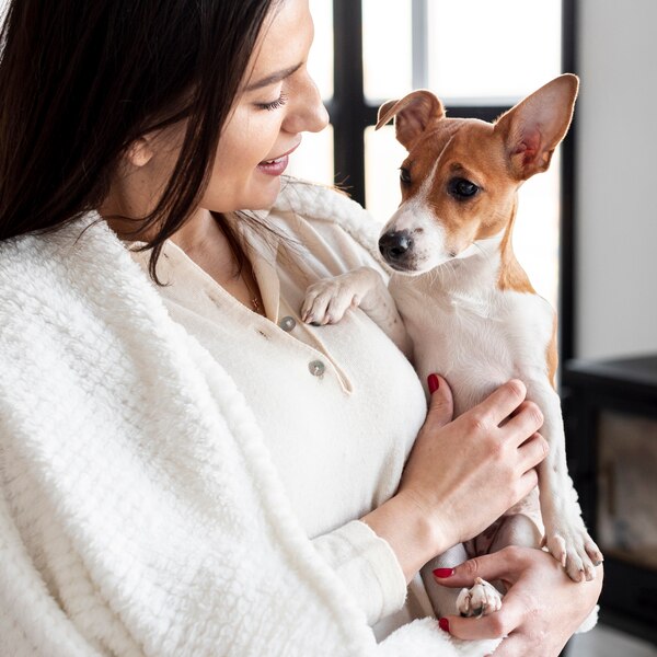 woman-holding-her-dog